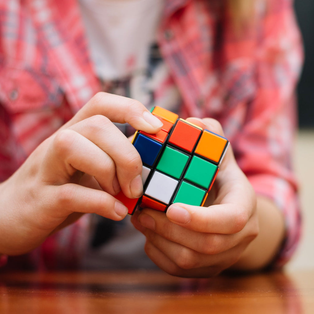 A Rubik's Cube viewed from a slight angle, emphasizing its bright, colorful squares and durable ABS plastic construction.