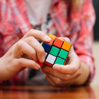 A Rubik's Cube viewed from a slight angle, emphasizing its bright, colorful squares and durable ABS plastic construction.