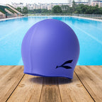 Dino themed silicone swim cap for kids with durable material and comfortable fit
