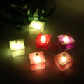 Set of multicolor LED flameless tealight candles glowing warmly