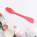 Dual-ended silicone mask brush from GlowForm, ideal for hygienic application and gentle facial cleansing.