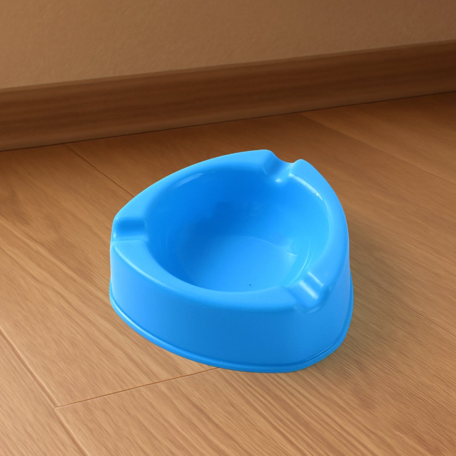 Plastic ashtray with wide bowl and cigarette rest slots in sky blue