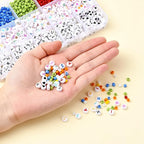 Open DIY bracelet making kit showcasing alphabet beads, tools, and string