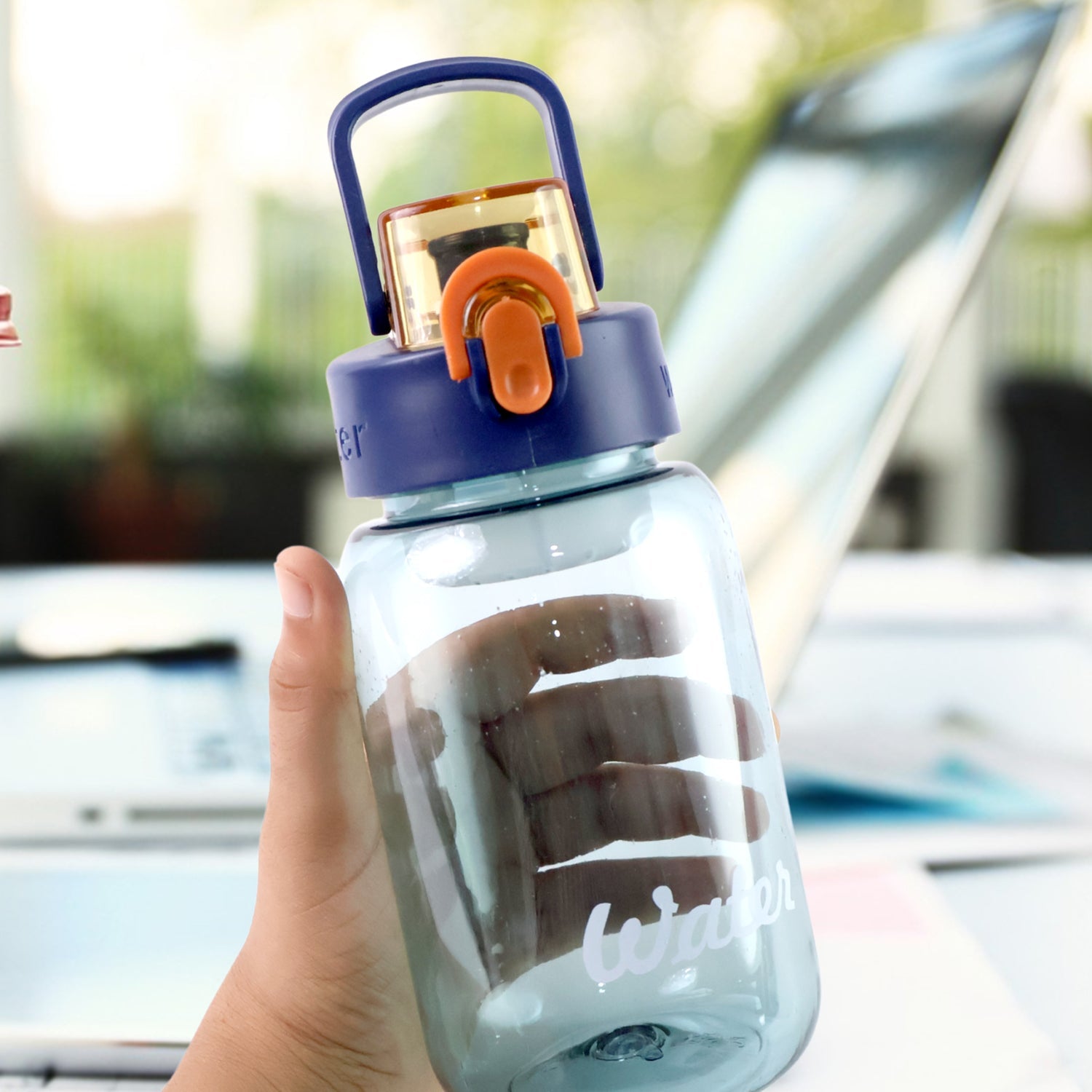 Side view of 600ml leak-proof plastic water bottle with flip cap