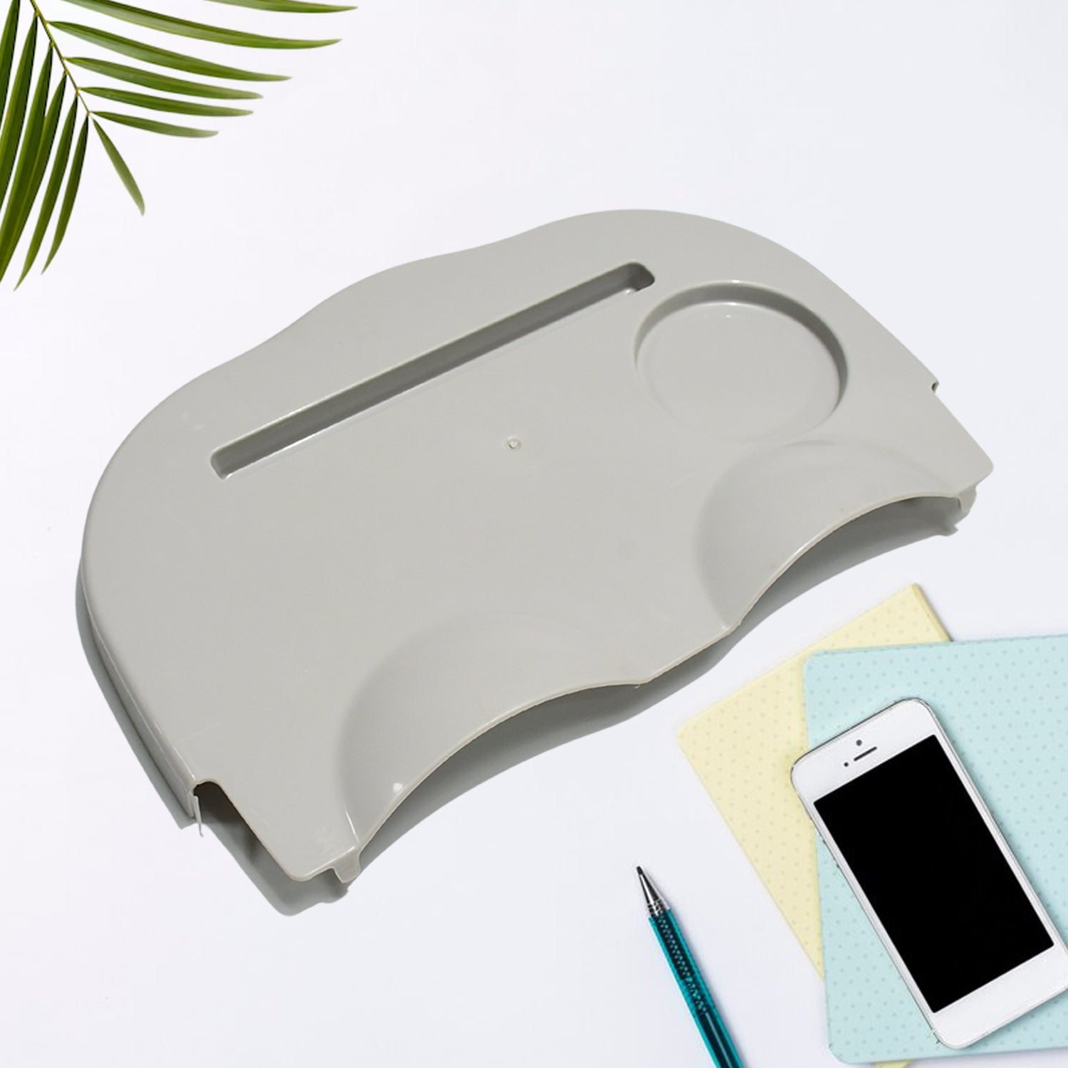 Top-down view of the Snack Tray with Built-In Cup Holder on a comfortable couch.