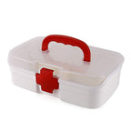Closed white First Aid Box displaying its clear lid, carrying handle, and red cross symbol.