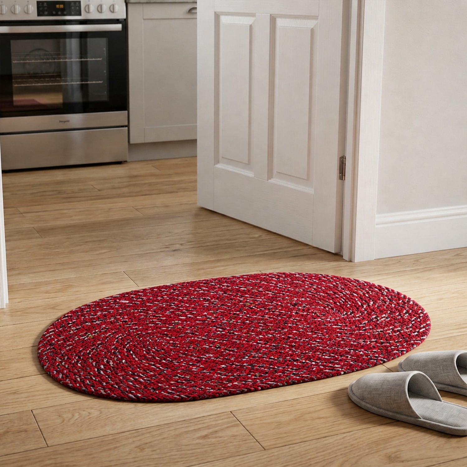 Outdoor style red oval floor mat with textured surface