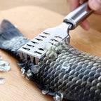 Set of stainless steel kitchen tools, including the fish scale remover.