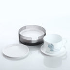 Durable plastic coasters effectively protecting a wooden surface from drink stains.
