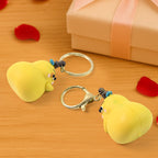 Cute Cartoon Couple keychains attached to a bag zipper