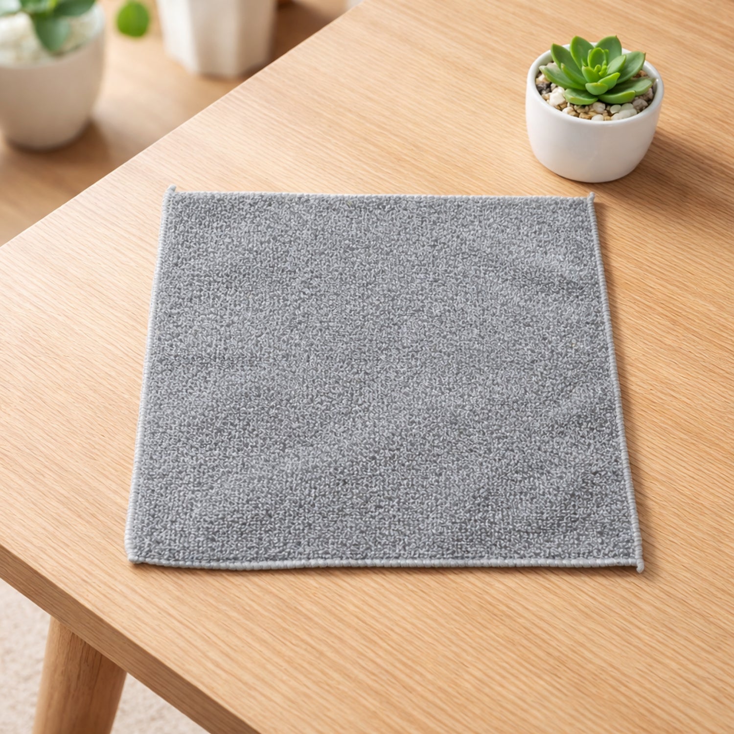 Folded ultra-soft microfiber cleaning cloth, showcasing its texture and size