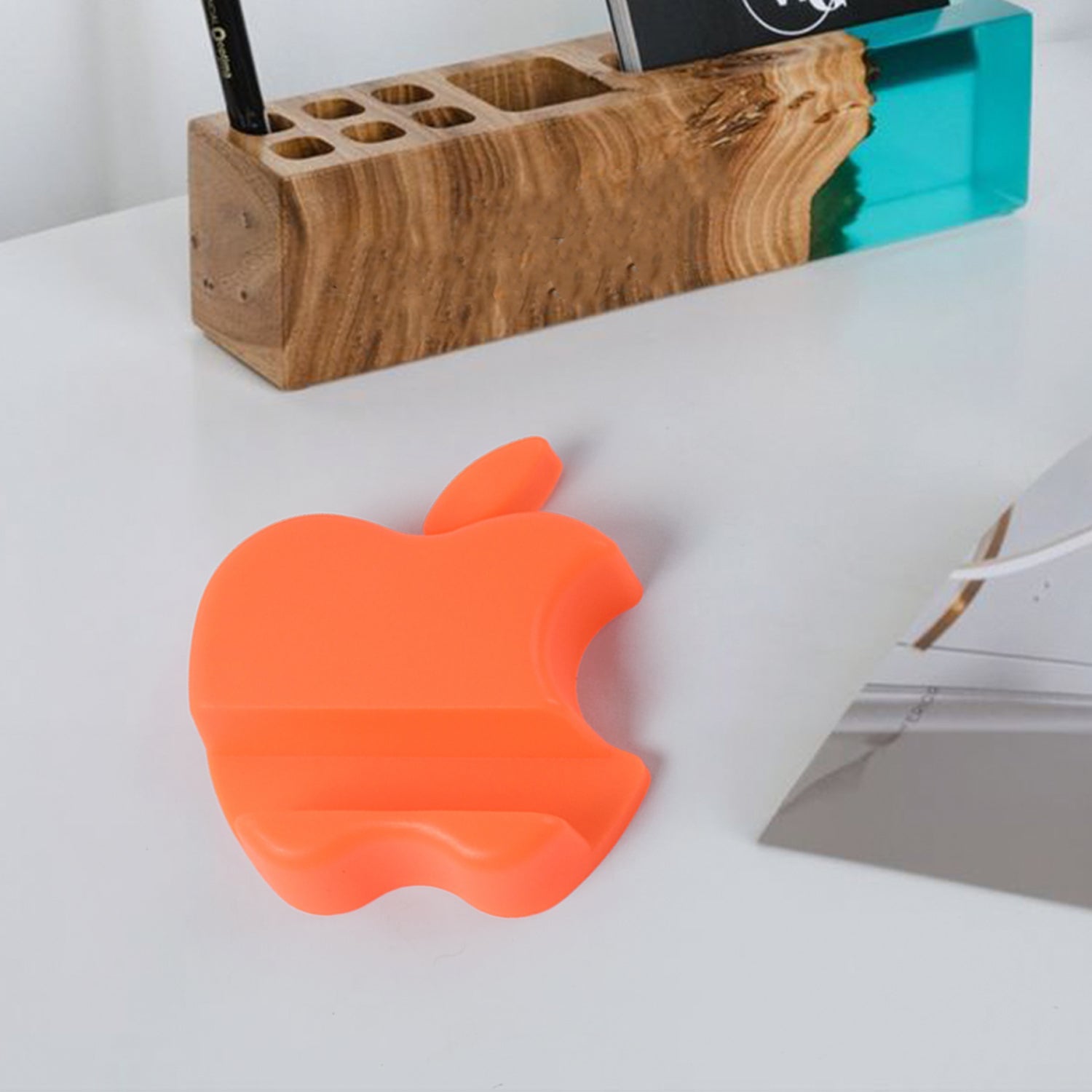 Apple-shaped mobile phone cradle with sturdy plastic design