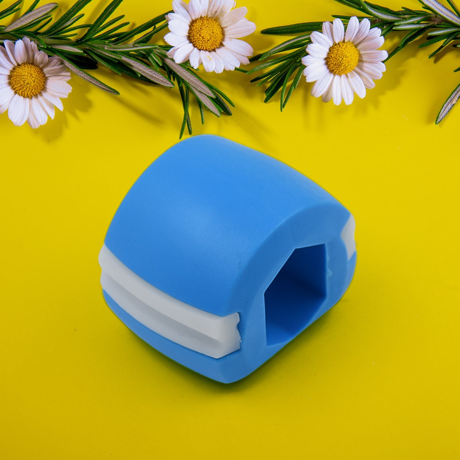Close-up of the durable blue Jawline Exerciser, highlighting its texture.