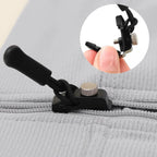Close-up of the versatile detachable zipper slider in use on a black jacket zipper.