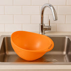 Side view of the ergonomic plastic rice and vegetable washing bowl.