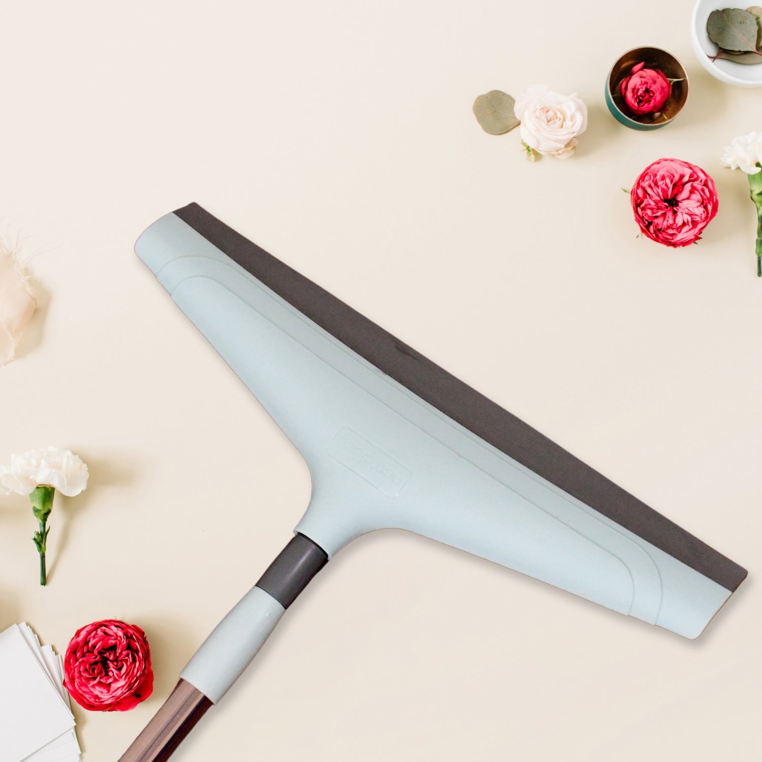 Close-up view of the 16-inch Ganesh floor wiper head and mild steel handle.
