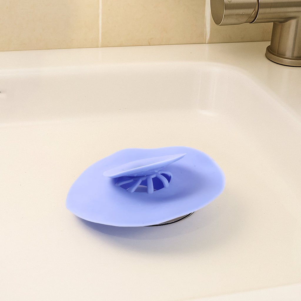 Blue silicone sink drain strainer on white background for kitchen clog prevention