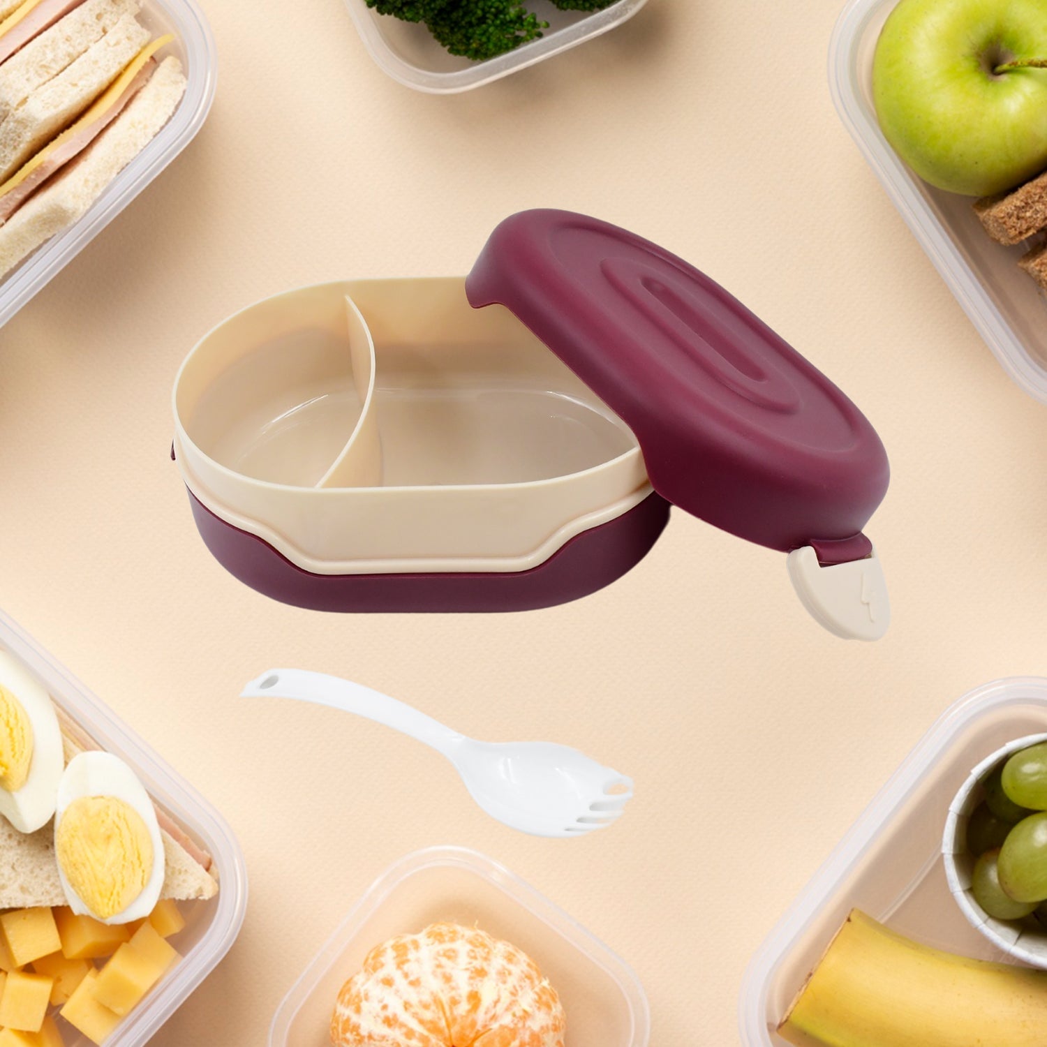 Top-down view of the 2-compartment lunch box, showing the included 2-in-1 spoon.
