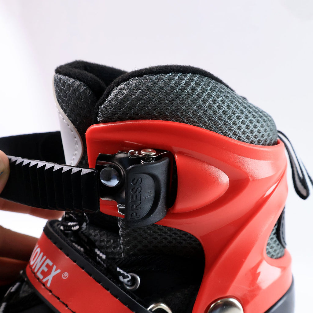Top view of black and red adjustable quad roller skates for children