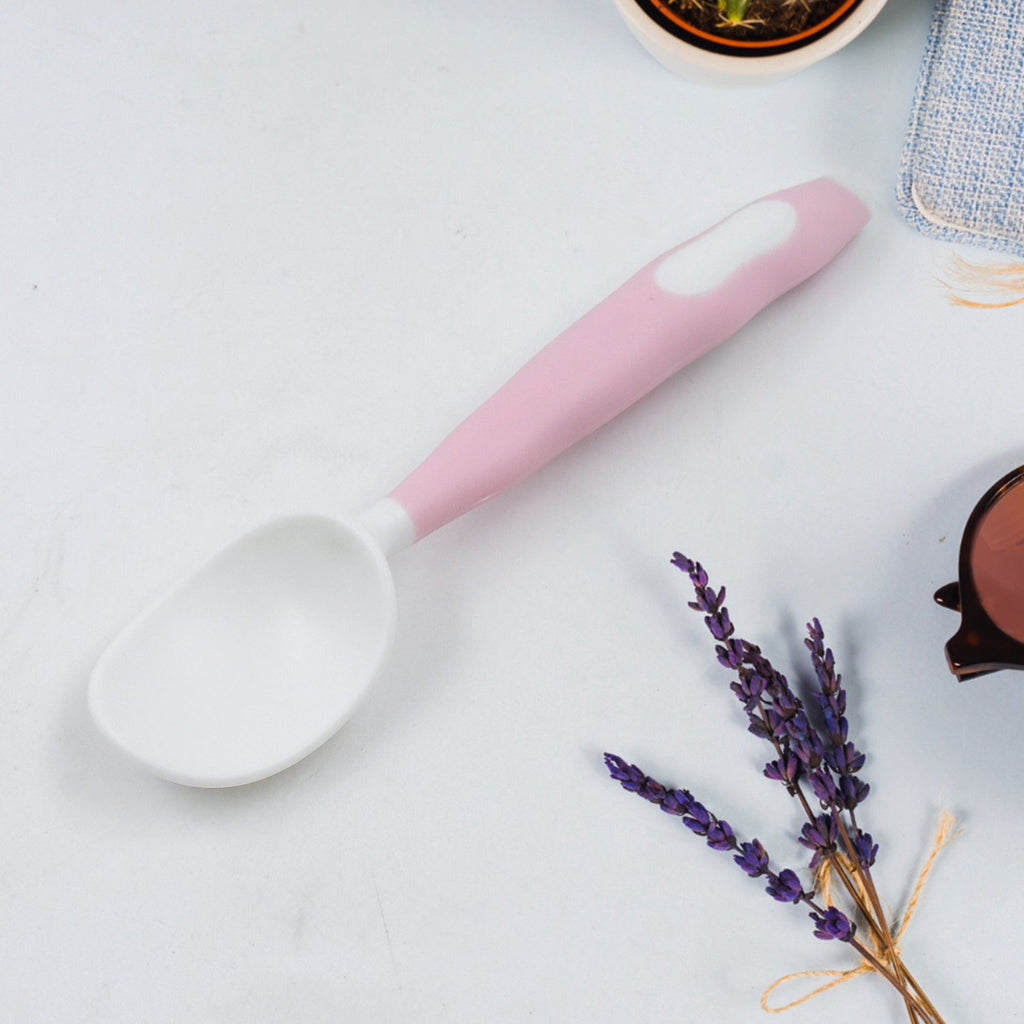 Two-piece silicone bendable self-feeding utensils for toddlers, shown with case.