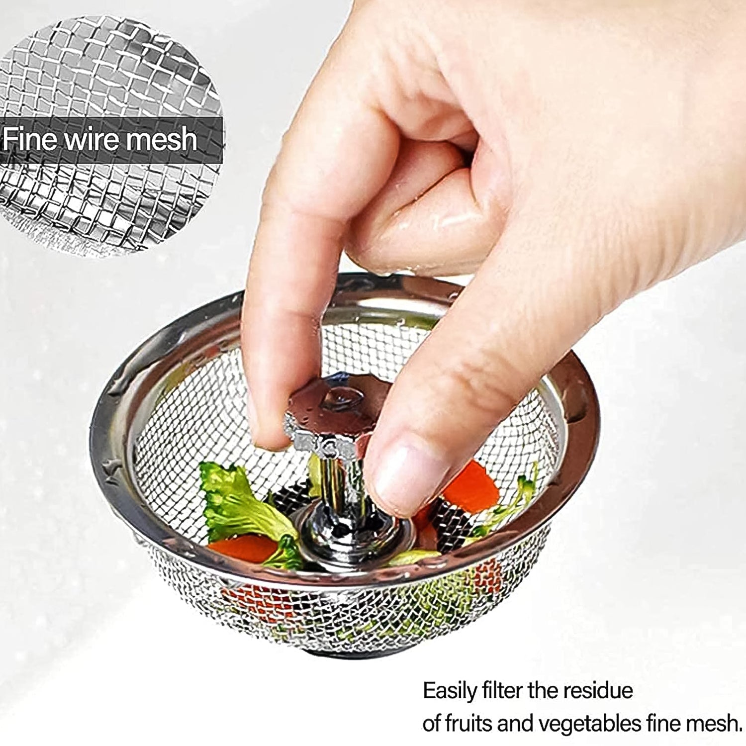 Stainless steel sink strainer in a kitchen basin, preventing food waste.