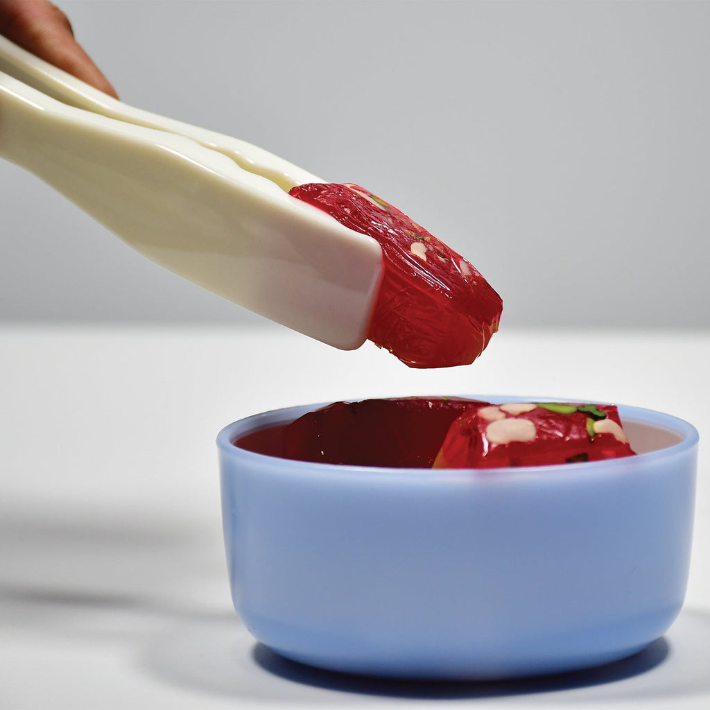 Food-grade plastic kitchen tongs with bread clamps for versatile cooking.