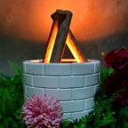 Airvanta bonfire effect diffuser creating a serene atmosphere on a wooden table.