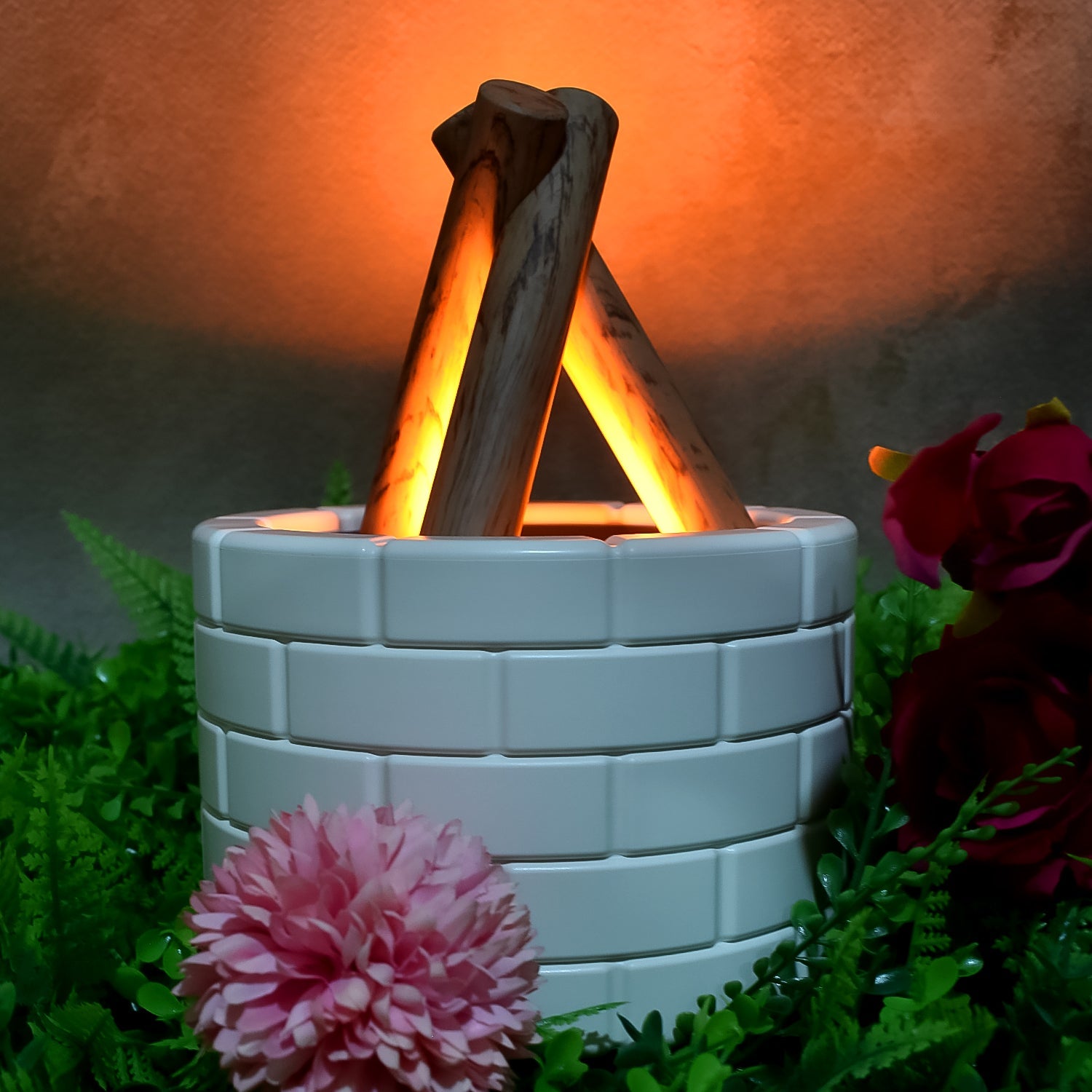 Airvanta bonfire effect diffuser creating a serene atmosphere on a wooden table.