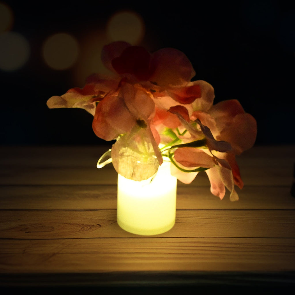 Four LED mood lights arranged decoratively on a table, showcasing their unique flower design.