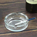Elegant round crystal glass ashtray, perfect for modern home decor.