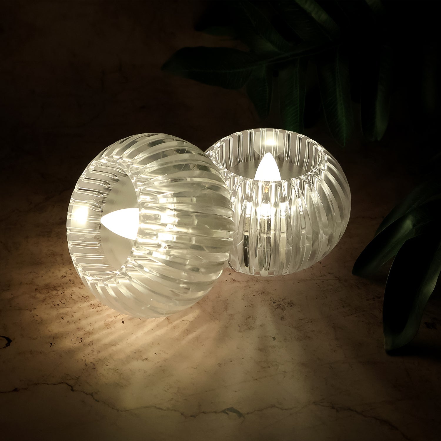 Four battery powered LED decorative candles emitting safe, smokeless light
