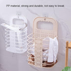 Wall-mounted laundry basket for space-saving clothes storage in a modern bathroom.