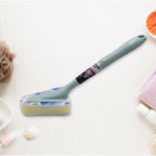 The versatile triangular cleaning brush resting on a bathroom counter.