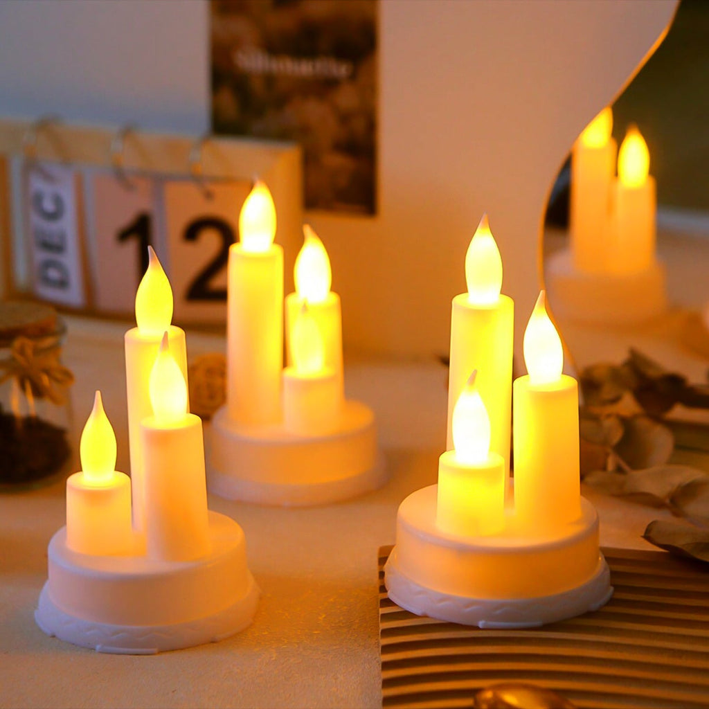 Two LED taper candles glowing softly in a dimly lit room, providing a safe, flameless alternative.