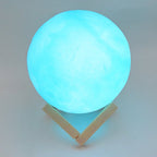 An elegant blue Moon Night Lamp casting a gentle glow, perfect for a cozy corner.