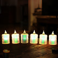 Close-up of a glowing flameless LED tea light candle in a festive setting.
