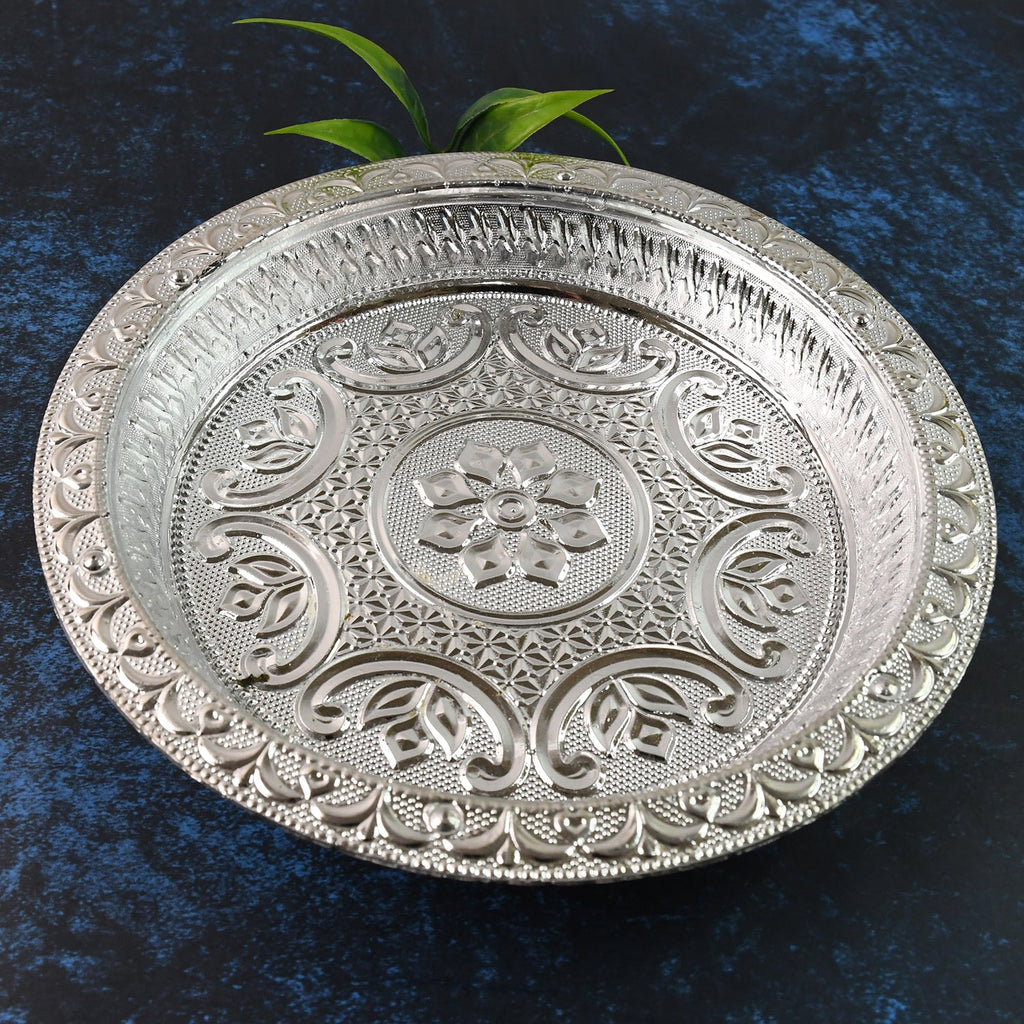 Silver finish plastic pooja thali with embossed floral design on surface