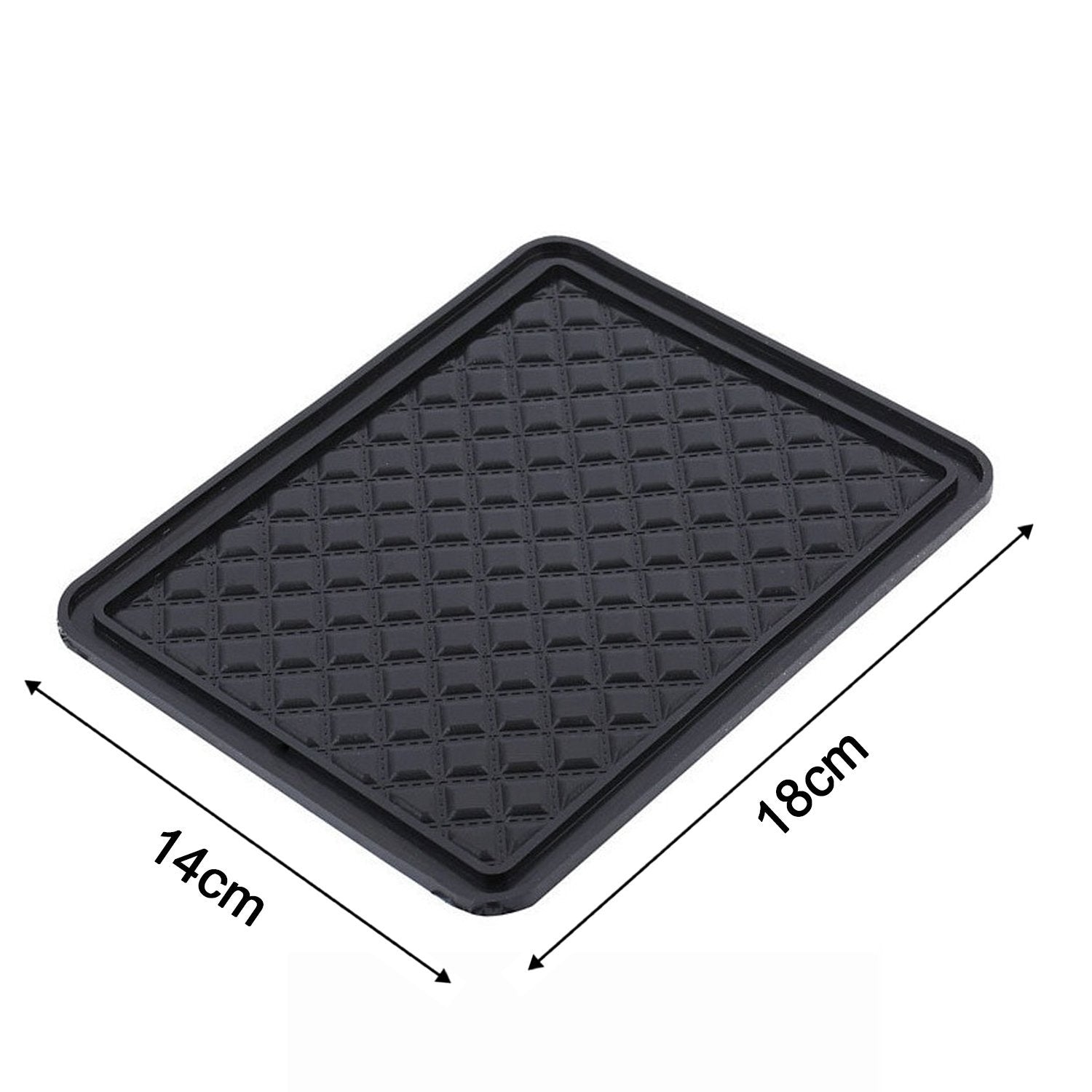 The non-slip anti-skid mat demonstrated holding small items firmly in place.