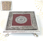Silver Pooja Chowki with intricate Lakshmi design, perfect for Diwali celebrations.