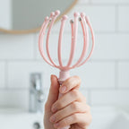 Portable head massager tool, ideal for travel and on-the-go relaxation.