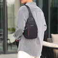 Waterproof crossbody bag in black and grey, worn across the chest.