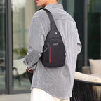 Waterproof crossbody bag in black and grey, worn across the chest.