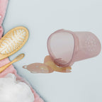 Front view of the waterproof teddy bear toothbrush holder installed on a tile wall.