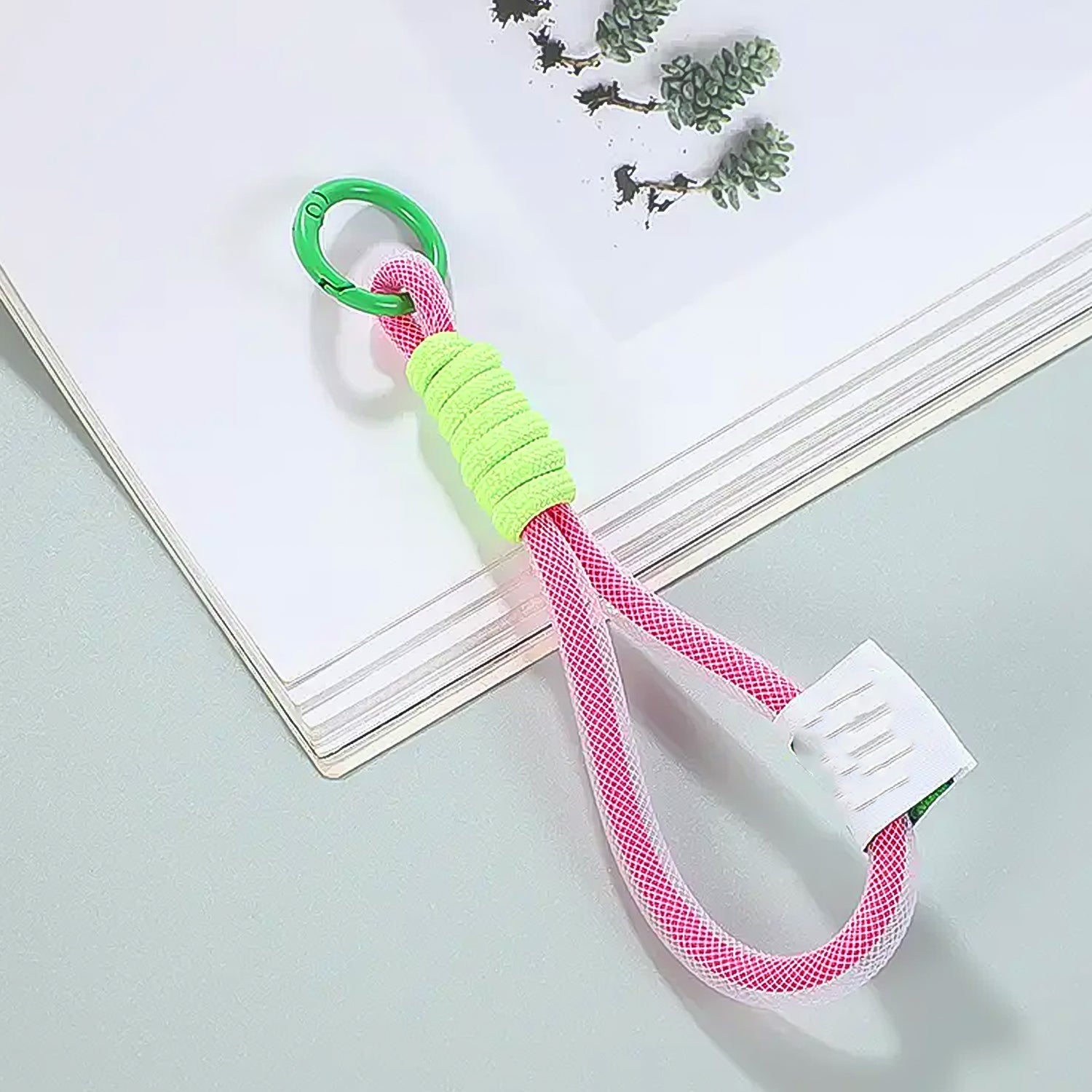 Close-up of the robust nylon phone wrist strap attachment mechanism.