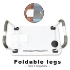 Compact foldable laptop desk shown in a comfortable bed setting.