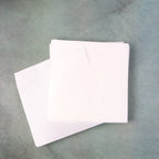Stack of white, grease-resistant non-stick food paper sheets, size 220x220 mm