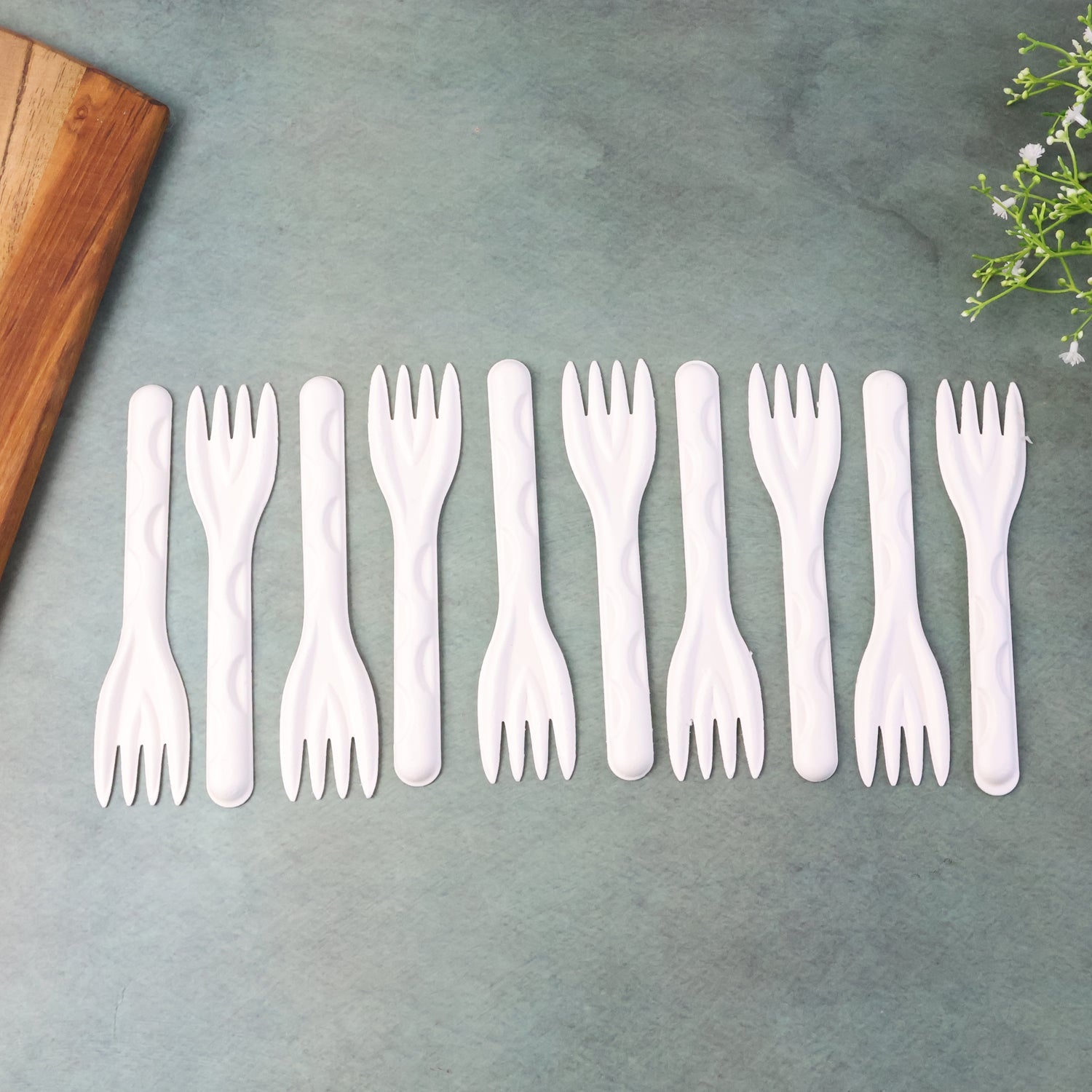 Compostable bagasse fork on table setting for eco-friendly dining