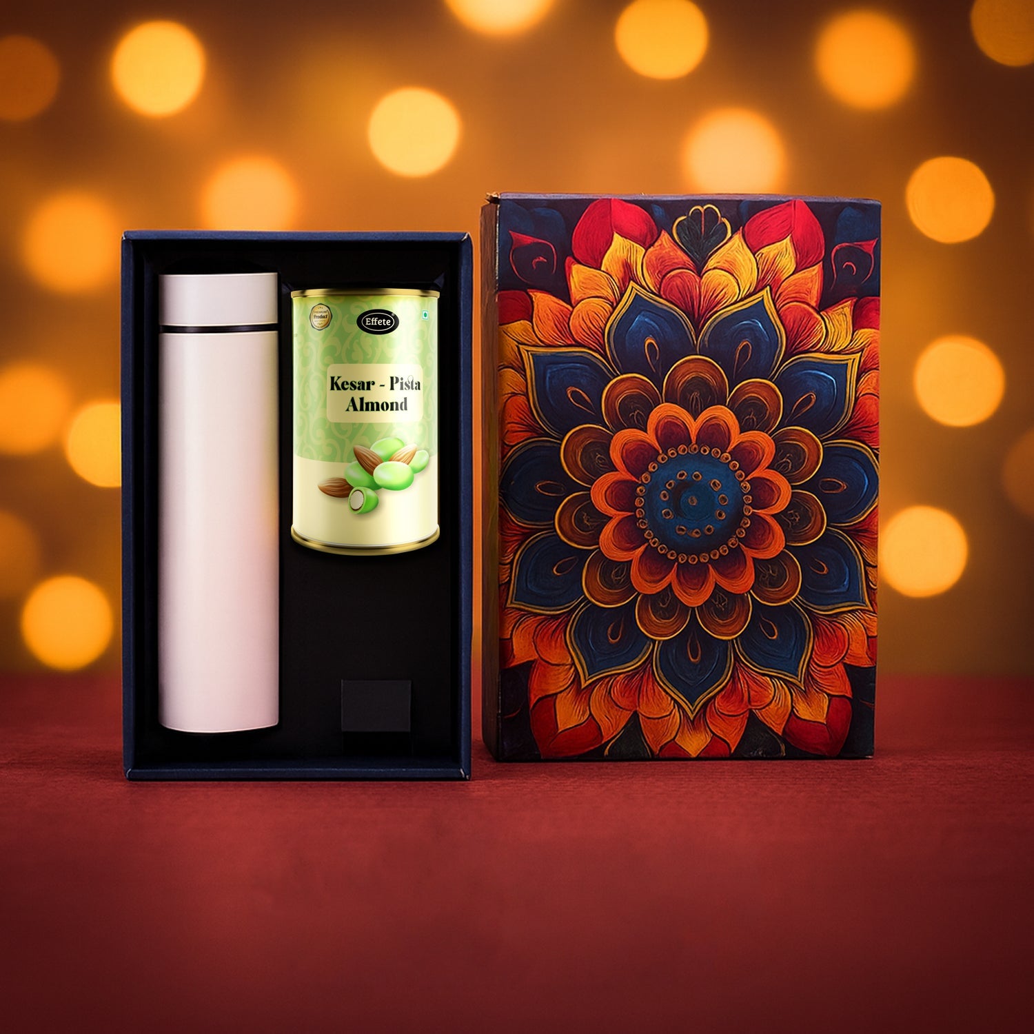 Golden festive Kesar Pista Almonds Gift Hamper box with stainless steel bottle and chocolates