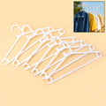 Set of 6 durable white plastic clothes hangers for closet organization