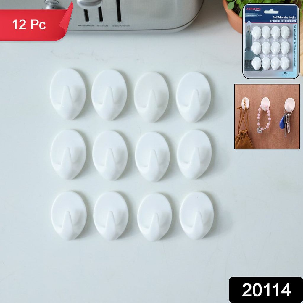 Set of strong self adhesive hooks on kitchen wall hanging towels